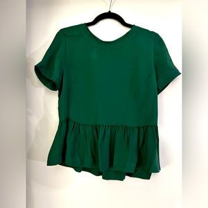Emerald silk peplum-style blouse